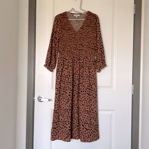 Long 3/4 sleeve maxi style dress with ruched bodice.